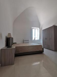 Postel nebo postele na pokoji v ubytování Antica Masseria Malvezzi