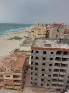 an aerial view of a building next to the beach at Sea spirit in Alexandria +78 photos
