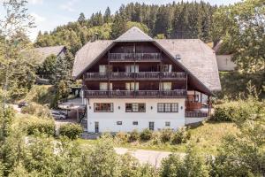 an aerial view of a large wooden house at stuub jostal in Titisee-Neustadt