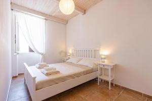 Posteľ alebo postele v izbe v ubytovaní Sea view New Apartment Ortigia