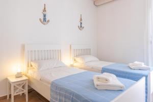 Posteľ alebo postele v izbe v ubytovaní Sea view New Apartment Ortigia
