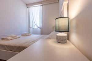 Posteľ alebo postele v izbe v ubytovaní Sea view New Apartment Ortigia