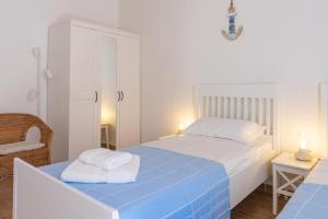 Posteľ alebo postele v izbe v ubytovaní Sea view New Apartment Ortigia