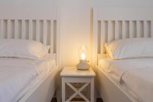 Posteľ alebo postele v izbe v ubytovaní Sea view New Apartment Ortigia