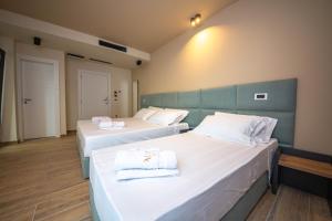 Postel nebo postele na pokoji v ubytování Hotel Alion21
