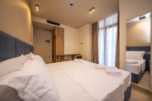 Postel nebo postele na pokoji v ubytování Hotel Alion21