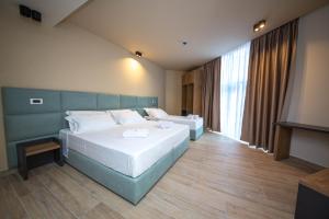 Postel nebo postele na pokoji v ubytování Hotel Alion21