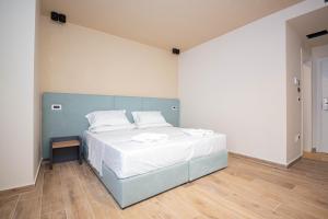 Postel nebo postele na pokoji v ubytování Hotel Alion21