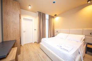 Postel nebo postele na pokoji v ubytování Hotel Alion21