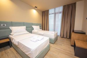 Postel nebo postele na pokoji v ubytování Hotel Alion21
