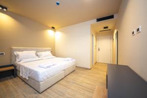 Postel nebo postele na pokoji v ubytování Hotel Alion21