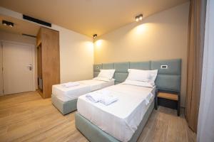 Postel nebo postele na pokoji v ubytování Hotel Alion21