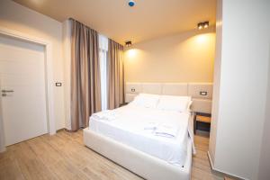 Postel nebo postele na pokoji v ubytování Hotel Alion21