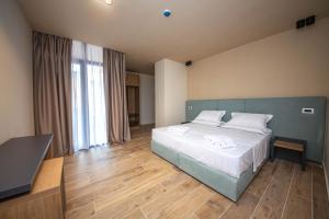 Postel nebo postele na pokoji v ubytování Hotel Alion21