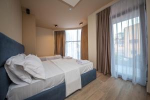 Postel nebo postele na pokoji v ubytování Hotel Alion21