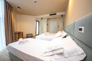 Postel nebo postele na pokoji v ubytování Hotel Alion21