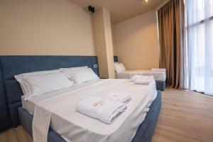 Postel nebo postele na pokoji v ubytování Hotel Alion21