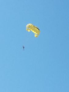 a person flying a yellow parachute in the sky at House for rest in Batumi