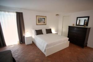 Posteľ alebo postele v izbe v ubytovaní Palazzo Marletta Duomo Apartment