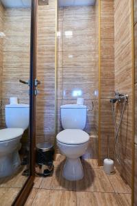 a bathroom with a toilet and a sink at Apartment Knjaz Boris in Pomorie