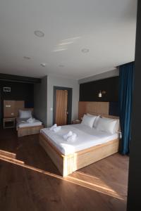 Postel nebo postele na pokoji v ubytování Taşliman Otel