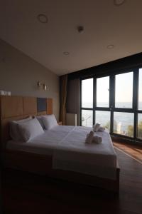 Postel nebo postele na pokoji v ubytování Taşliman Otel