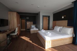 Postel nebo postele na pokoji v ubytování Taşliman Otel