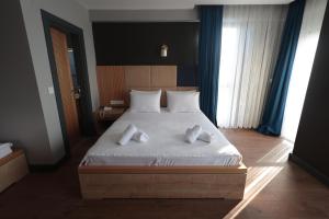 Postel nebo postele na pokoji v ubytování Taşliman Otel