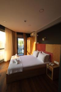 Postel nebo postele na pokoji v ubytování Taşliman Otel