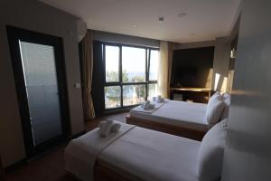Postel nebo postele na pokoji v ubytování Taşliman Otel