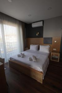 Postel nebo postele na pokoji v ubytování Taşliman Otel