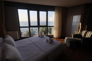Postel nebo postele na pokoji v ubytování Taşliman Otel