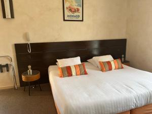 Postel nebo postele na pokoji v ubytování hôtel Le Synaya