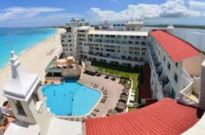 an aerial view of a hotel and the beach at Cancun Plaza Condo Ocean front in Cancún