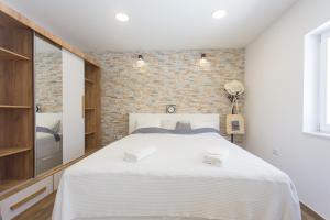 Posteľ alebo postele v izbe v ubytovaní Studio Nomadic Kastela