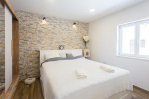 Posteľ alebo postele v izbe v ubytovaní Studio Nomadic Kastela