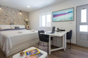Posteľ alebo postele v izbe v ubytovaní Studio Nomadic Kastela