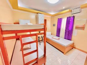 Postel nebo postele na pokoji v ubytování Wency Amor Hotel