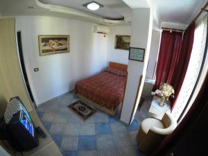 Posteľ alebo postele v izbe v ubytovaní Hotel Ideal