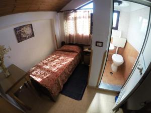 Posteľ alebo postele v izbe v ubytovaní Hotel Ideal