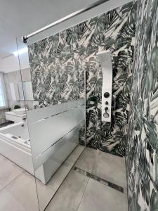 a bathroom with a black and white wallpaper at CA.FOSCARI HARMONY in Milan