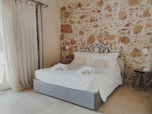 Cama ou camas em um quarto em Case Marianeddi