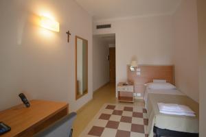 Postel nebo postele na pokoji v ubytování Domus Stella Maris - Casa per Ferie