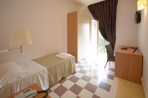 Postel nebo postele na pokoji v ubytování Domus Stella Maris - Casa per Ferie