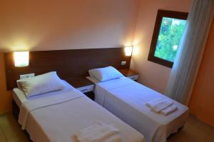 a hotel room with two beds and a window at Farmside OTEL in Fethiye +36 photos