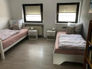 A bed or beds in a room at Ferienwohnung Sonnenterrasse