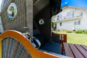 a close up of the back of a car with a bench at Hoff dom przy morzu in Trzęsacz