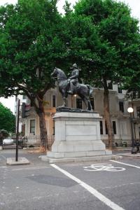 a statue of a man riding a horse in a parking lot at Super Apartment in Kensington Next To Hyde Park in London