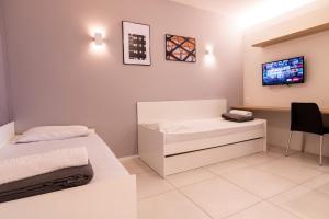 Кровать или кровати в номере Ilhasul Hotel Residencia