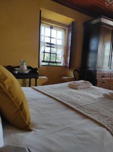 Een bed of bedden in een kamer bij Casas da Quinta da Cancela